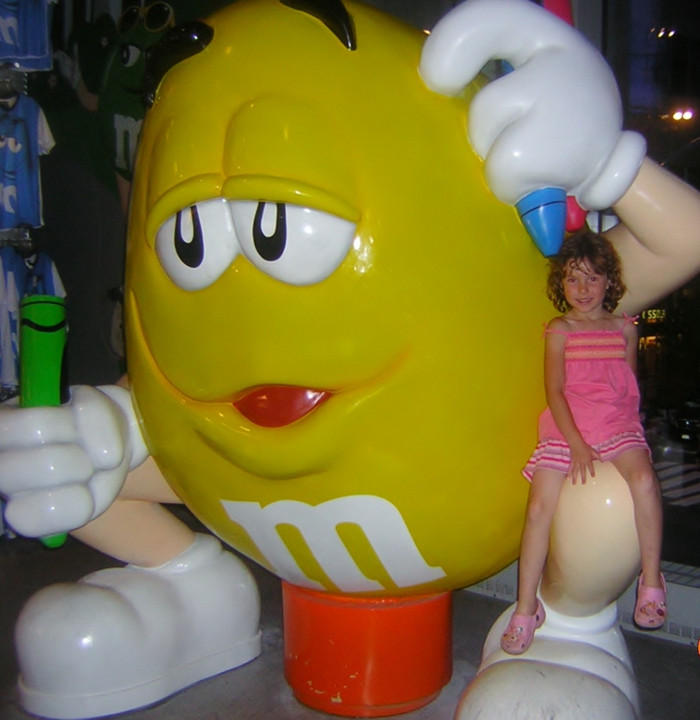 Abby hanging out at M&Ms store and she doesn't even like chocolate!